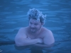 Steam is condensating in your hair while in the pool. It\'s so cool it becomes ice.